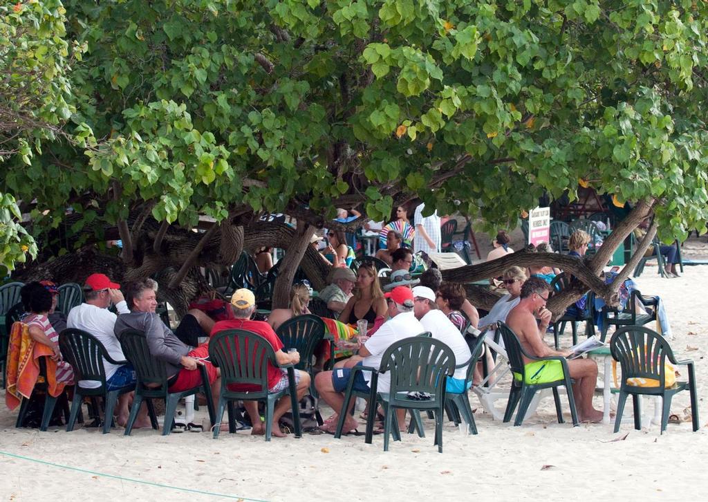 Competitors relax at the club after a tough day on the water  - Mount Gay Round Barbados Race Series. ©  Peter Marshall / MGRBR